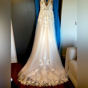 Unaltered bridal gown;  size 8; light gold color; lace and floral embellishments